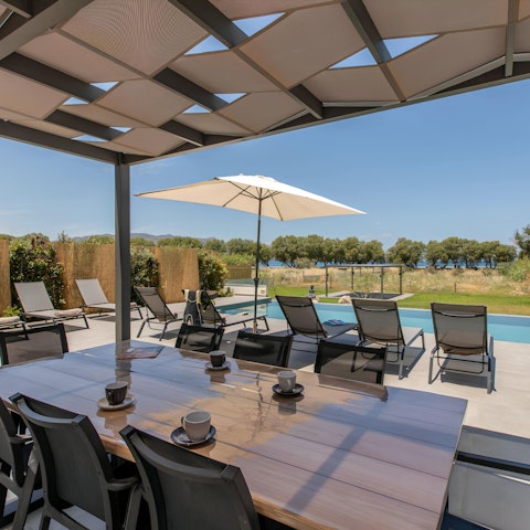 Enjoy alfresco meze overlooking the private pool