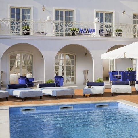 Dive into the private swimming pool to beat the heat