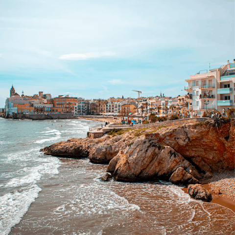 Make a splash at Sitges Beach, just a fourteen-minute drive away