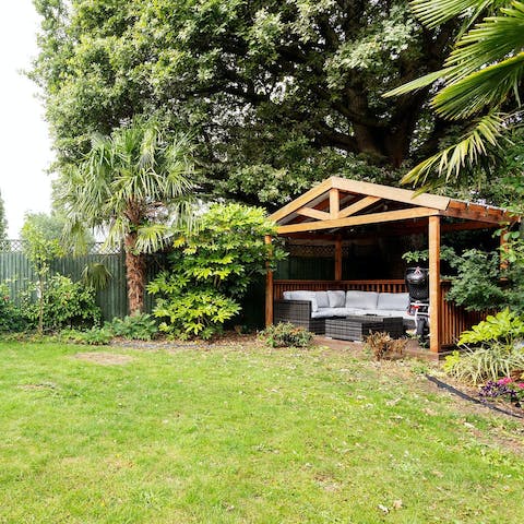 Enjoy a round of drinks in the garden as the sun starts to set