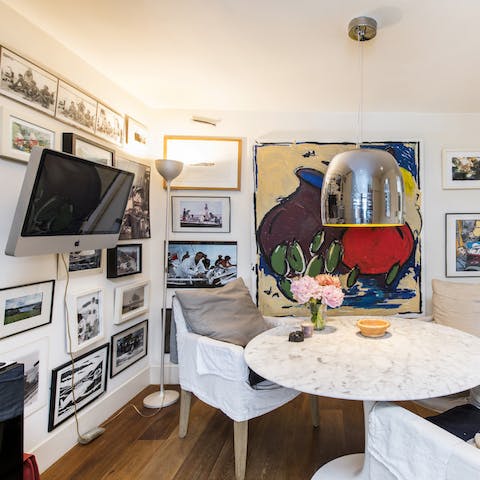 Breakfast table surrounded by art
