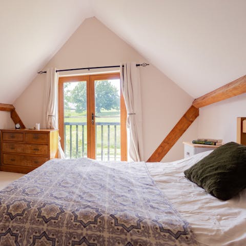 Make the most of the master bedroom's Juliet balcony with views across the grounds