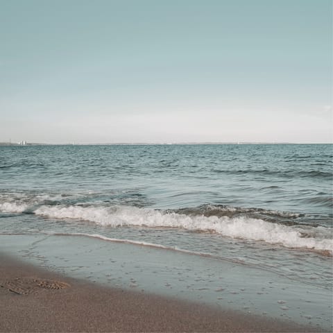 Spends days at the beach – less than a minute away on foot