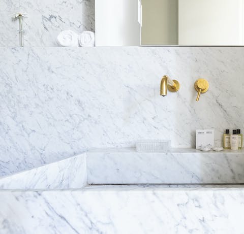 The opulent marble bathroom
