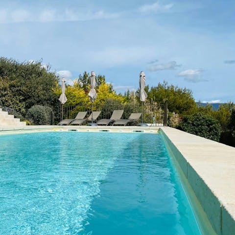 Enjoy a refreshing dip in the pool overlooking the valley