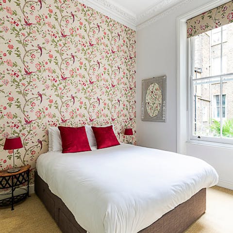 Drift off to sleep in the elegant bedroom's king-sized bed