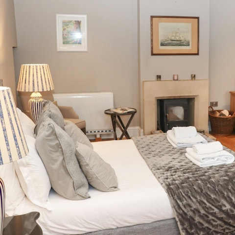 Cosy up in bed as the fire crackles