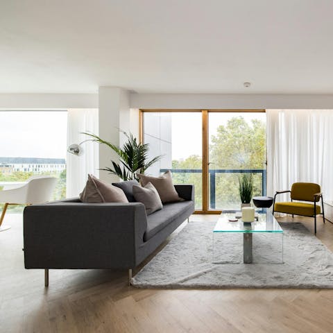 Pad outside to the balcony or relax in the bright living area