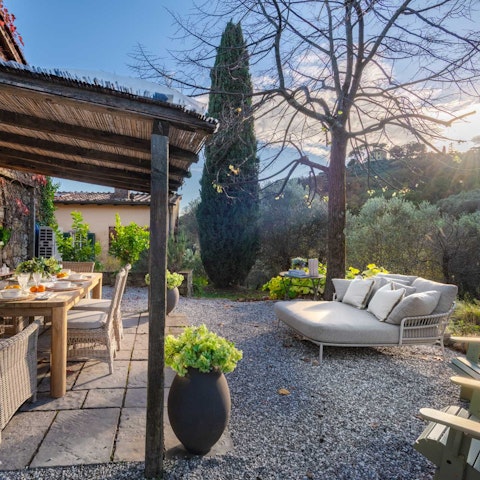 Stretch out under the sun with a glass of local wine