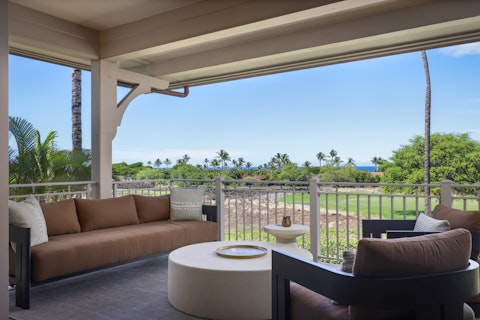 Unwind on the shaded lanai overlooking the golf course and ocean