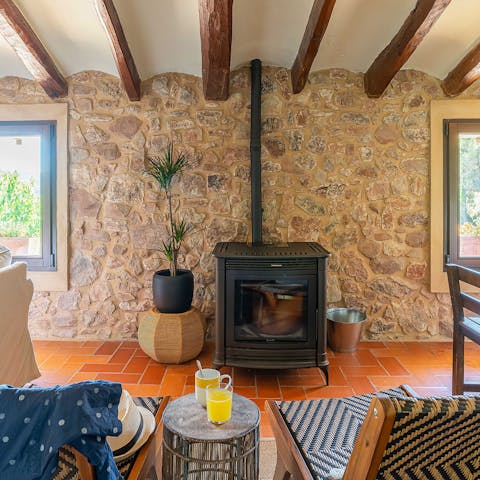 Get toasty and warm around the fireplace in the rustic living room