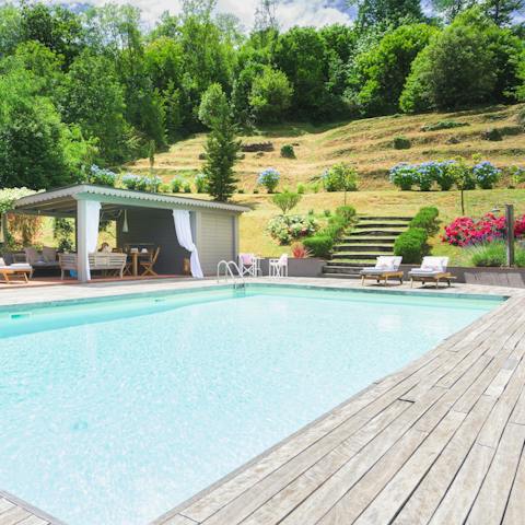 Descend the garden steps to be met with the crystal blue waters of the private pool