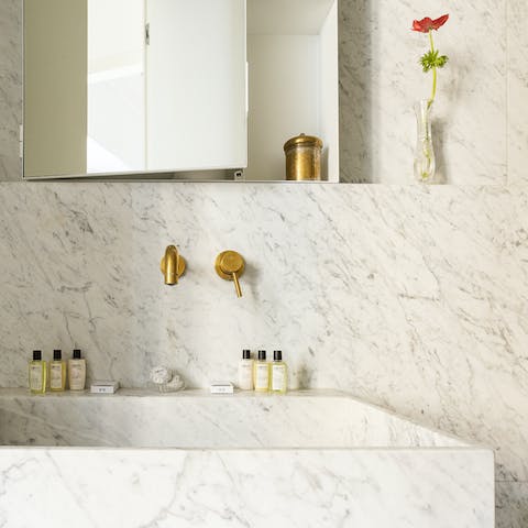 The opulent marble bathroom