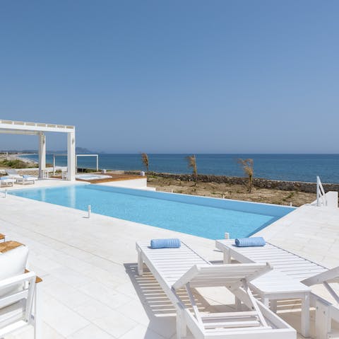 Spend your days drifting between the beach and your own private pool