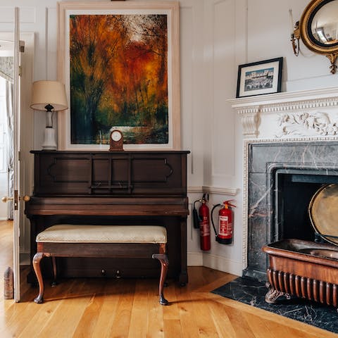 Play a tune on the piano in the hallway