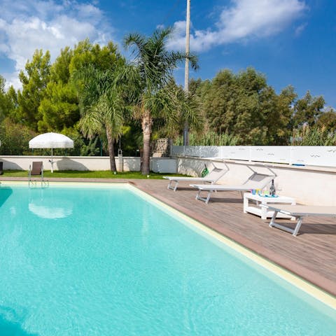 Relax by the private outdoor pool while you top up your sun tan