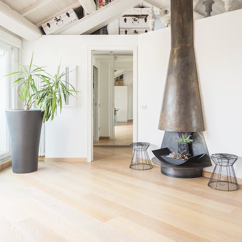 Enjoy sophisticated design touches like the metal fireplace