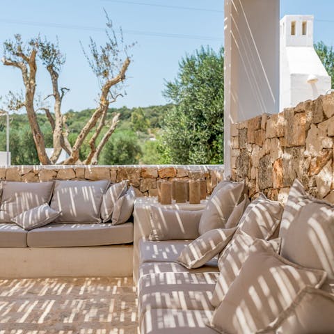 Pour a glass of your favourite drink and watch the sunset across the valley