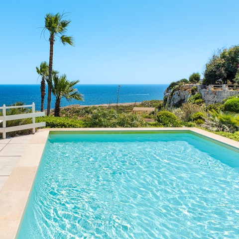 Gaze out over the sea from the private swimming pool