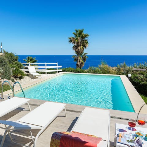 Gaze out over the sea from the private swimming pool