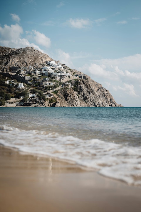 Unwind on Ftelias Beach, a short distance away