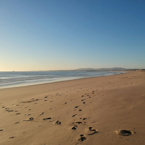 Sink your toes into the soft sand of Salema Beach, right on your doorstep