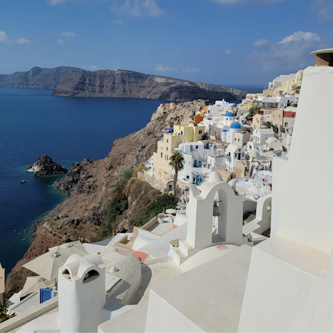Stay in one of Santorini's hillside towns overlooking the Aegan Sea