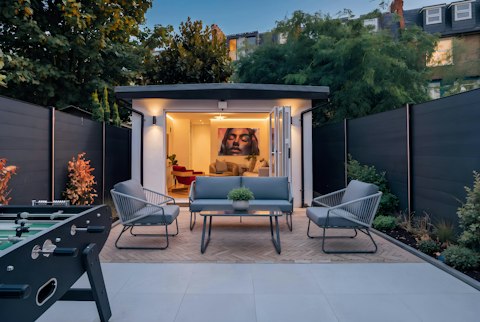 Step out into the courtyard garden with its separate snug