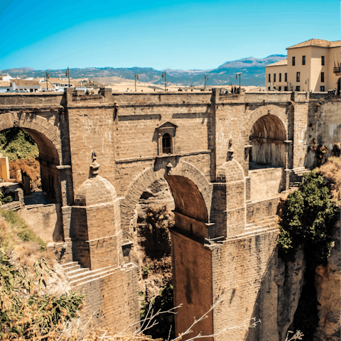 Explore the mountaintop city of Ronda, home to Moorish architecture, striking scenery and a lookout offering views over the deep gorge