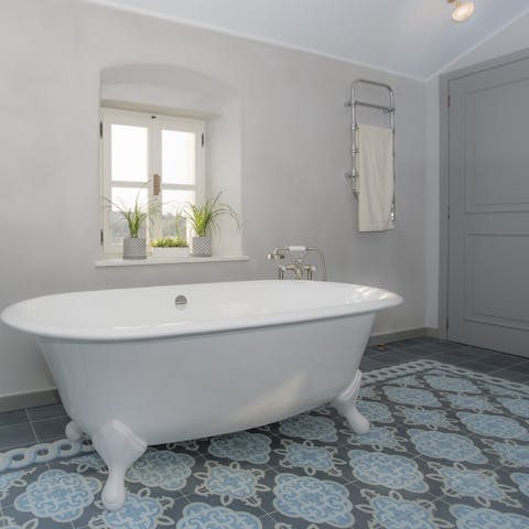 Treat yourself to a long and soothing soak in one of the clawfoot bathtubs