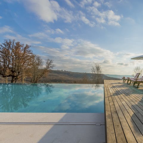 Splash about in the swimming pool while admiring the rustic views