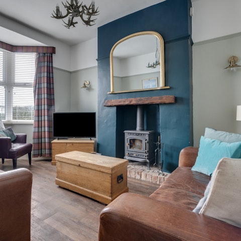 Spend downtime in the living room with a fire crackling away in the stove