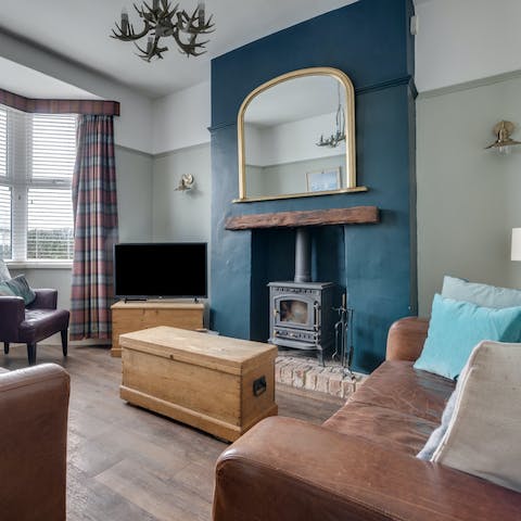Spend downtime in the living room with a fire crackling away in the stove