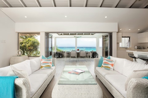 Take in the seaside scenery in the white-washed living space