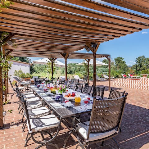Dine beneath the pergola covered in fragrant jasmine