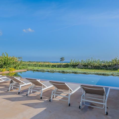 Claim a lounger and take in the sea views