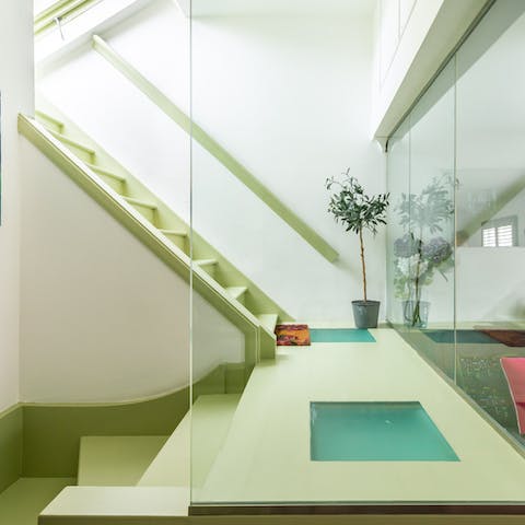 Climb the glass-enclosed stairs to reach your outdoor rooftop haven