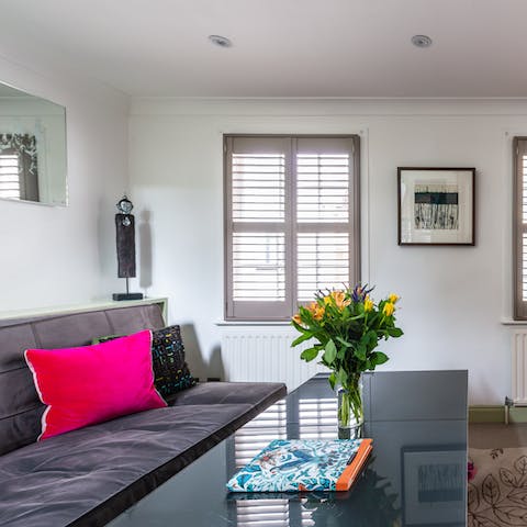 Unwind in the living room with a glass of wine and some delicious treats bought at Covent Garden market