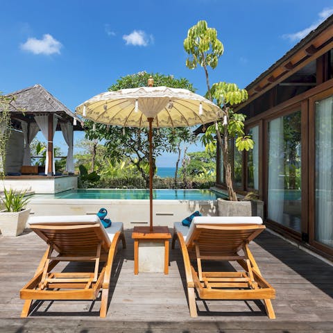 Find peace and relaxation while lounging by the pool