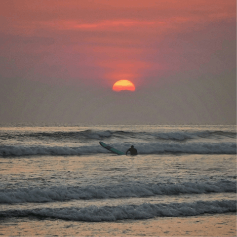 Embrace the waves in Seminyak – a short shuttle ride away