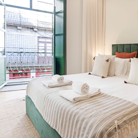Throw open the doors to the bedroom to listen to the sound of Porto below