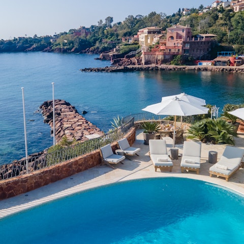 Feel the sea breeze on your skin as you swim in the heated pool