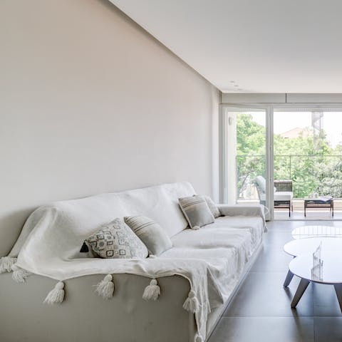 Pour yourself a glass of Israeli wine and relax in the bright living space