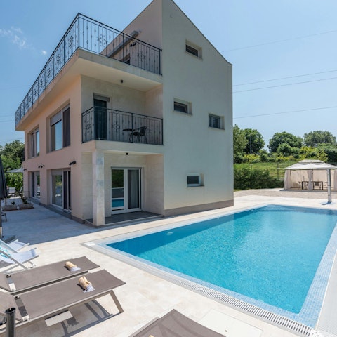 Splash around in the swimming pool or soak up the sun