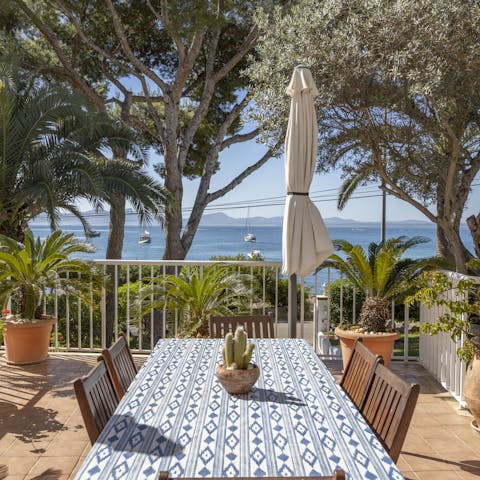 Dine with a view of the boats bobbing in the crystal-clear sea