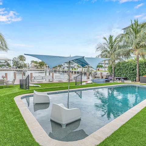 Swim in the heated pool, overlooking the Mayan Lake.