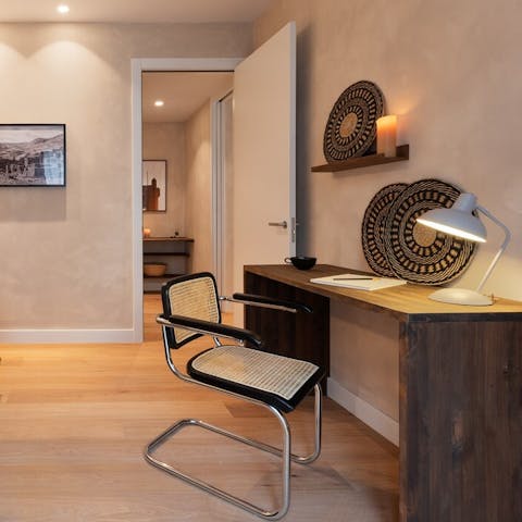 Catch up on work at the bedroom's desk space