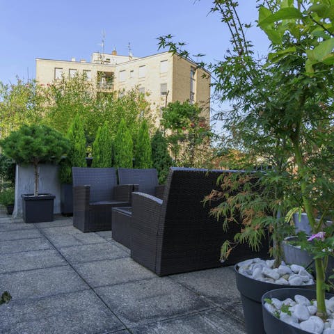 Relax on the shared terrace after a busy day sightseeing