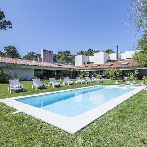 Swim laps in the inviting pool set in the lawn