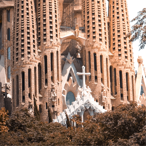 Admire the stunning architecture of La Sagrada Familia – a seventeen–minute walk away